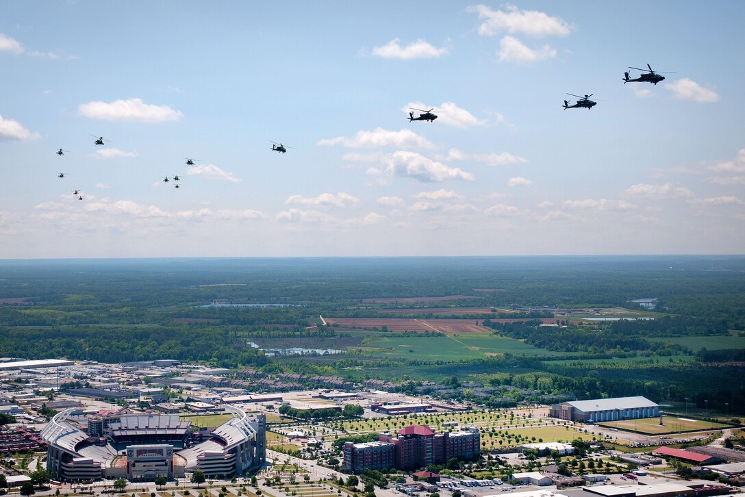 AH-64D Apache helicopters fly in formation over Eastover, S.C., April 23, 2016, to participate in gunnery qualifications and annual training at Fort Stewart, Ga. South Carolina Army National Guard photo by Staff Sgt. Roberto Di Giovine