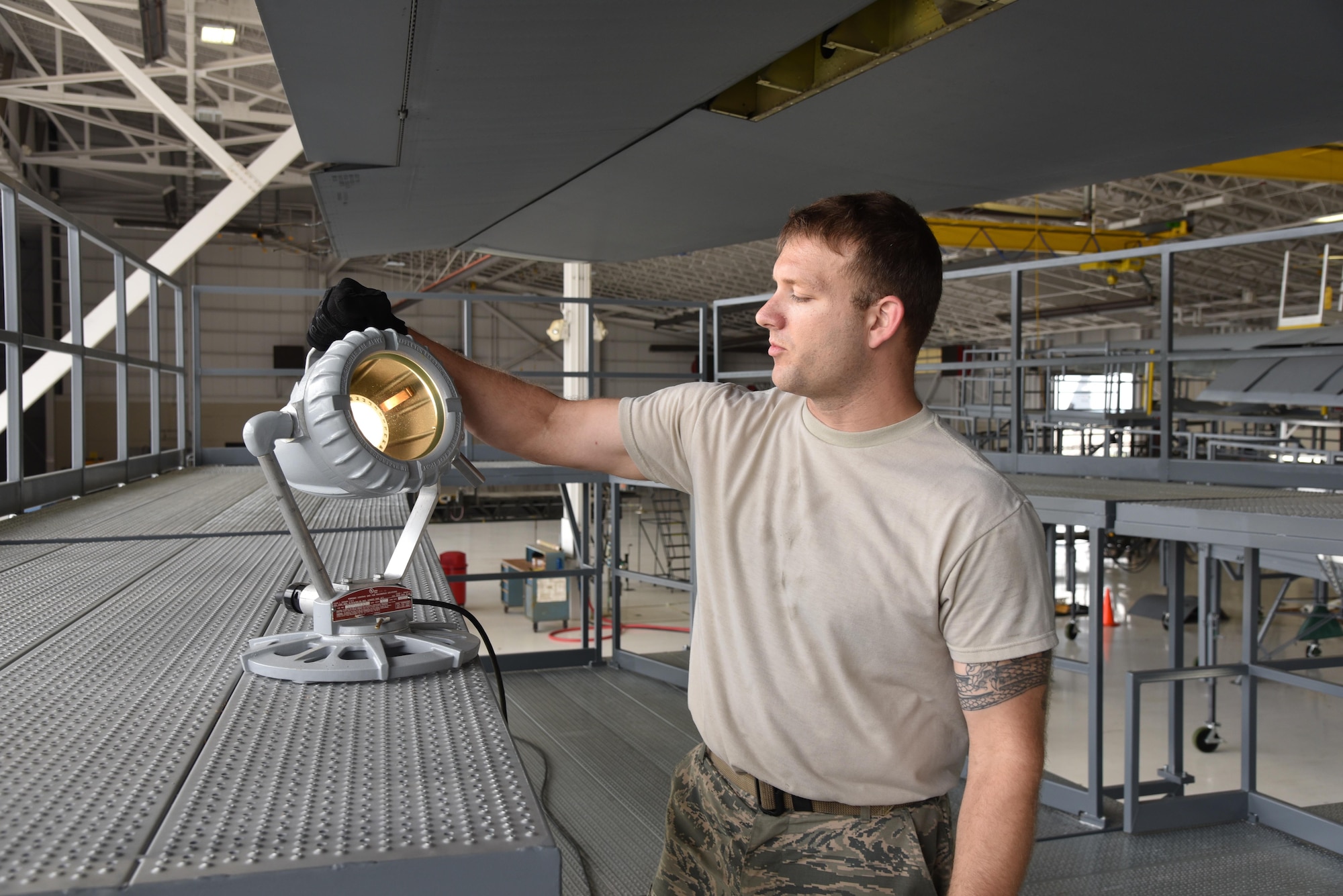 Staff Sgt. Kevin Cheatham, 403rd Maintenance Squadron Isochronal inspection technician and support equipment manager at Keesler Air Force Base, Mississippi, shows one of the portable lights on the new maintenance platforms, commonly referred to as “stands,” April 29, 2016. The squadron recieved the new stands April 14, 2016. The previous stands became outdated, not meeting fall protection limits, and they were not configured all the way around the aircraft. The new stands are placed completely around the aircraft to include the nose and tail sections, provide more working area and access to power and lighting. (U.S. Air Force photo/Maj. Marnee A.C. Losurdo)