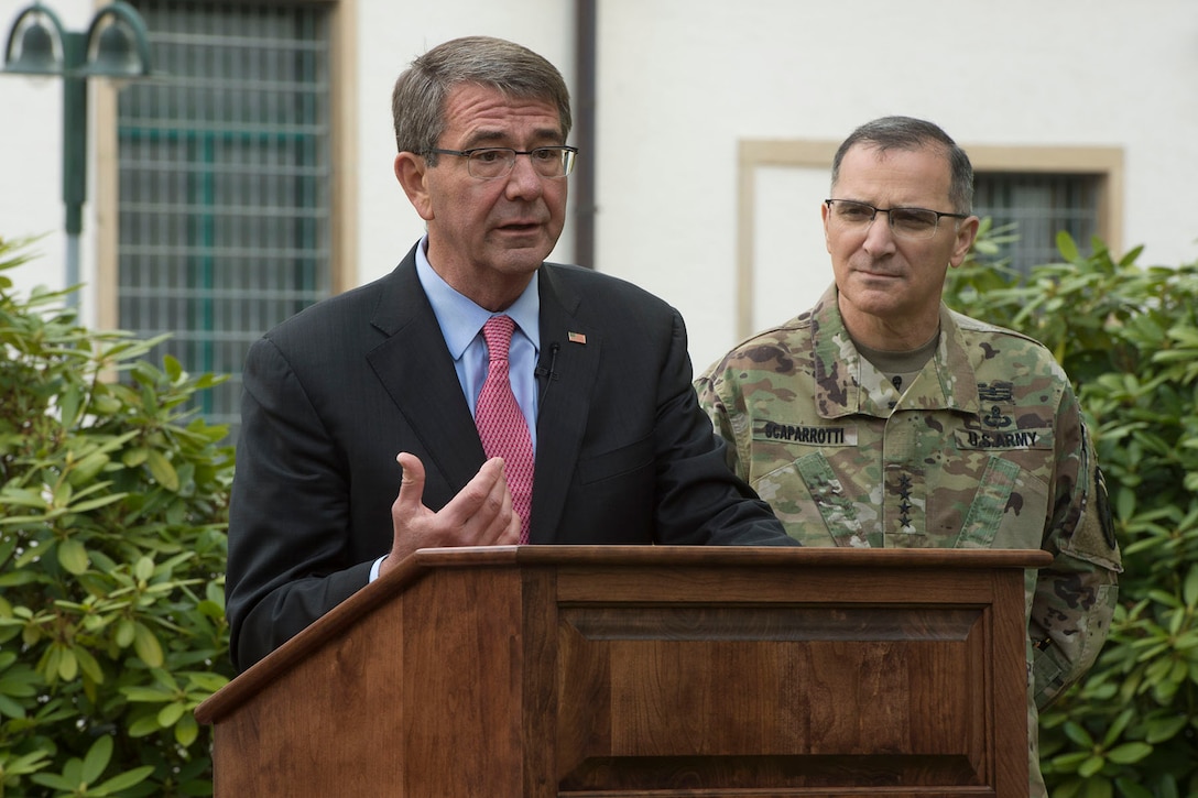 Defense Secretary Ash Carter speaks at  the U.S. European Command's change-of-command ceremony alongside Eucom commander Army Gen. Curtis Scaparrotti in Stuttgart, Germany, May 3, 2016. DoD photo by Navy Petty Officer 1st Class Tim D. Godbee