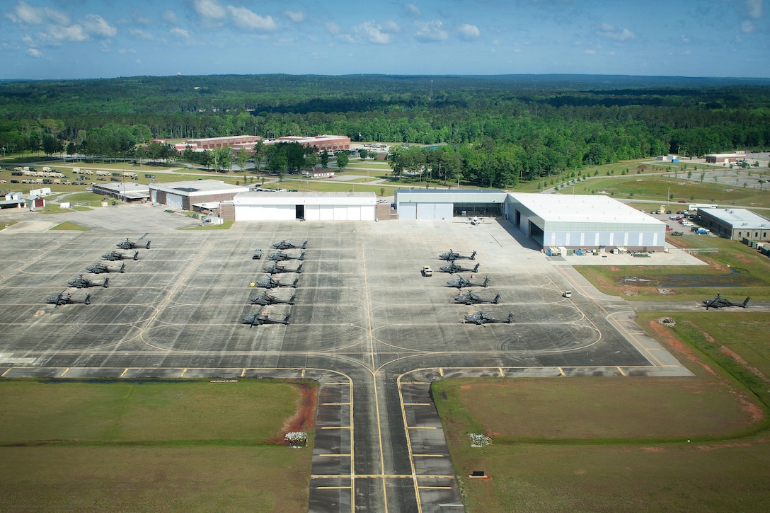 AH-64D Apache helicopters sit in an assembly area and await orders to depart McEntire Joint National Guard Base, Eastover, S.C., April 23, 2016, to participate in gunnery qualifications and annual training at Fort Stewart, Ga. The helicopter crews are assigned to the South Carolina Army National Guard’s 1st Battalion, 151st Attack and Reconnaissance Battalion. South Carolina Army National Guard photo by Staff Sgt. Roberto Di Giovine