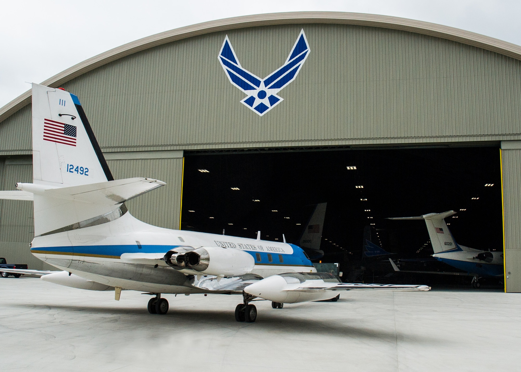 DAYTON, Ohio -- The Lockheed VC-140B JetStar being towed into the fourth building at the National Museum of the United States Air Force. (U.S. Air Force photo by Ken LaRock)