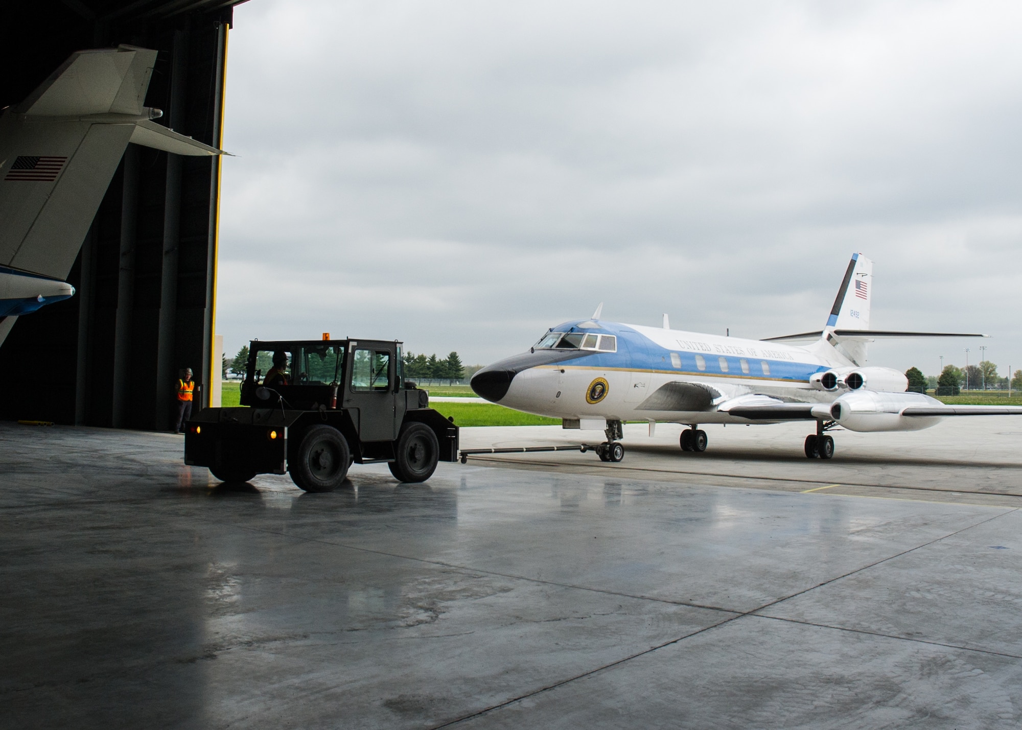 DAYTON, Ohio -- The Lockheed VC-140B JetStar being towed into the fourth building at the National Museum of the United States Air Force. (U.S. Air Force photo by Ken LaRock)