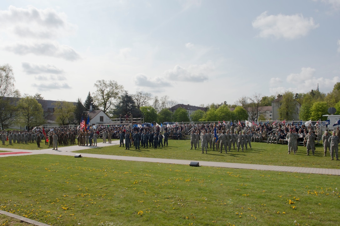 Service members stand at ease as Defense Secretary Ash Carter makes remarks during the U.S. European Command change-of-command ceremony in Stuttgart, Germany, May 3, 2016. Air Force Gen. Philip M. Breedlove relinquished command to Army Gen. Curtis M. Scaparrotti as commander of U.S. European Command. DoD photo by Navy Petty Officer 1st Class Tim D. Godbee