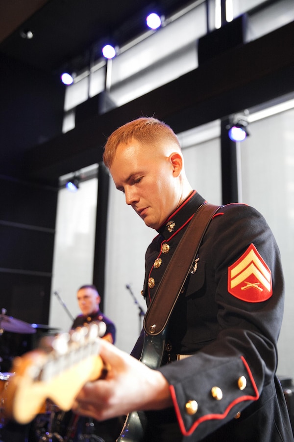 U.S. Marine Corps Cpl. Mike Borowski strumms the notes to Benny Golson's "Whisper Not" during a performance at the Dizzy's Club Coca-Cola at the Jazz at Lincoln Center overlooking New York's Central Park, Saturday, April 23, 2016. Borowski, who graduated from Duquesne University with his master's degree in music, lived month-to-month looking for various music gigs before a rare opportunity allowed him to travel across the country as a Marine musician with the Marine Band San Diego.