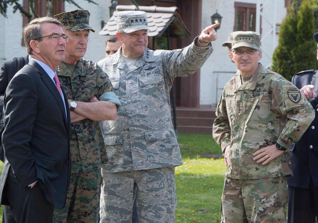 Defense Secretary Ash Carter, left, and Marine Corps Gen. Joe Dunford, second from left, chairman of the Joint Chiefs of Staff, talk with Air Force Gen. Philip M. Breedlove, center, the outgoing commander of U.S. European Command, and Army Gen. Curtis M. Scaparrotti, right, the incoming Eucom commander, in Stuttgart, Germany, May 3, 2016. DoD photo by Navy Petty Officer 1st Class Tim D. Godbee
