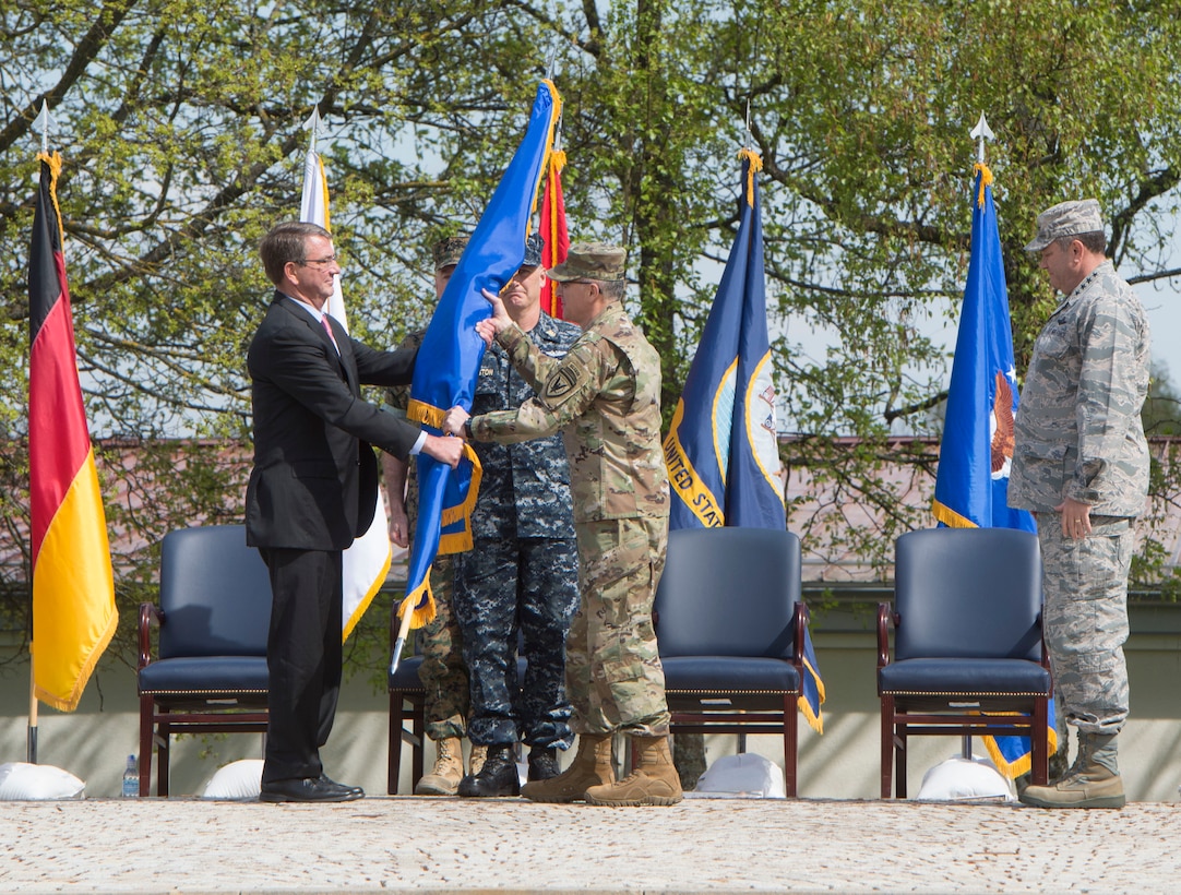 Defense Secretary Ash Carter presents the U.S. European Command flag to Eucom's new commander, Army Gen. Curtis M.
Scaparrotti, during a change-of-command ceremony in Stuttgart, Germany, May 3, 2016. DoD photo by Navy Petty Officer 1st Class Tim D. Godbee