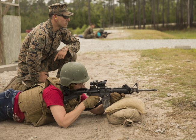 Candace Gordon, a spouse, engages target from the prone during II Marine Headquarters Group’s: “In Their Boots Day” aboard Camp Lejeune, N.C., April 29, 2016. During the course of fire, they shot in the standing, kneeling and prone position and received any needed corrections from the Marine assigned to them. (U.S. Marine Corps photo by Cpl. Justin T. Updegraff/ Released)