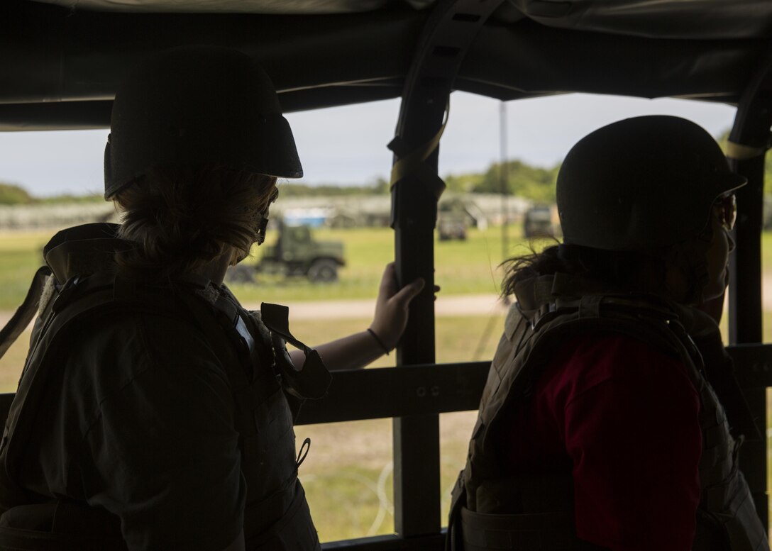 Spouses and family members climb into the back of 7 tons and go on a short tour of the training area during II Marine Headquarters Group’s: “In Their Boots Day” aboard Camp Lejeune, N.C., April 29, 2016. From eating Meals Ready to Eat to conducting a live fire range, family members and spouses experienced what the Marine Corps is all about. (U.S. Marine Corps photo by Cpl. Justin T. Updegraff/ Released)