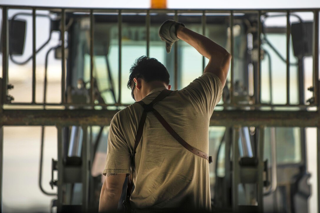 Air Force Senior Airman Chris Arnold directs a forklift carrying cargo for loading into a C-130J Super Hercules aircraft at Bagram Airfield, Afghanistan, April 29, 2016. Arnold is a loadmaster assigned to the 774th Expeditionary Airlift Squadron. Air Force photo by Senior Airman Justyn M. Freeman