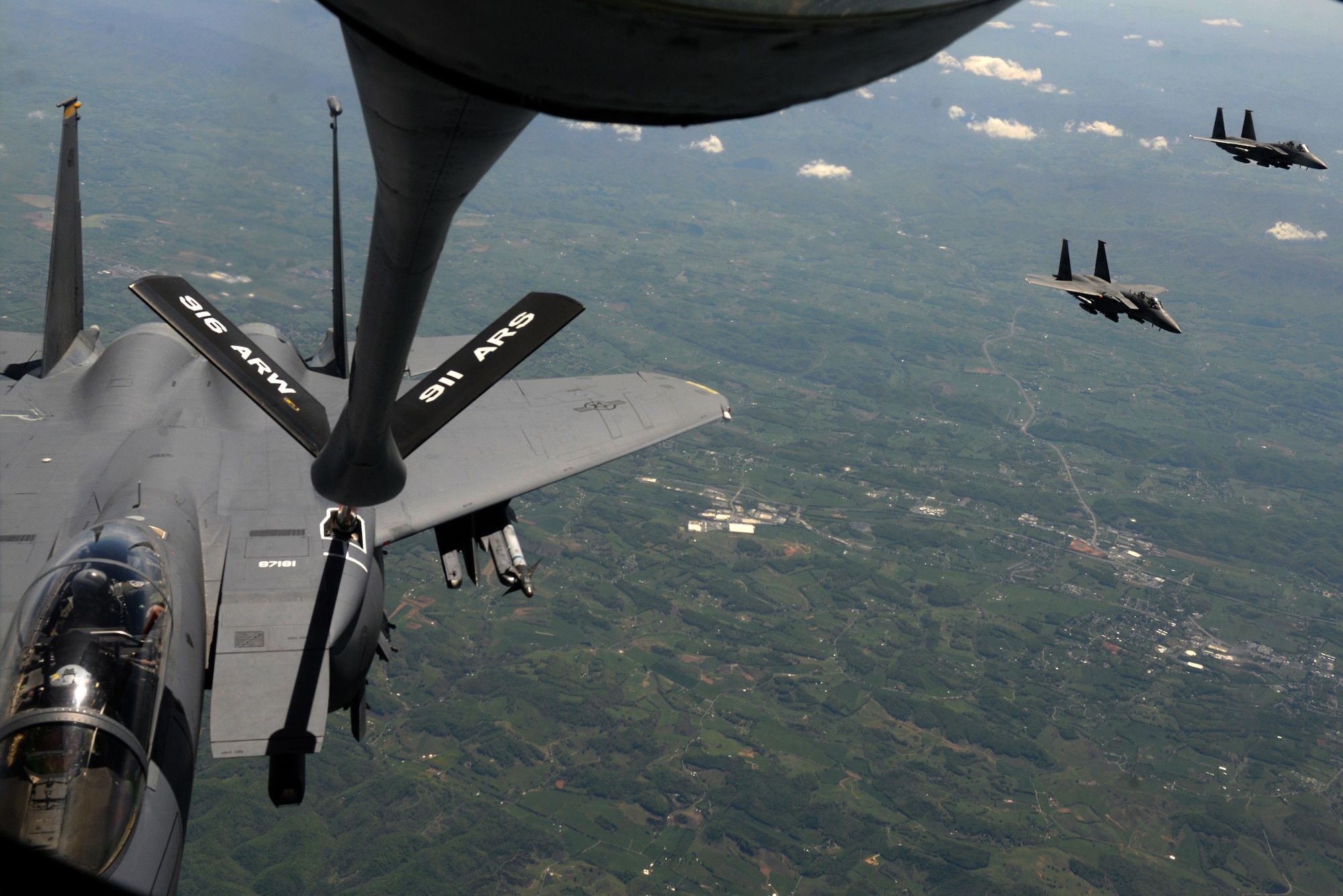 A 916th Air Refueling Wing KC-135R Stratotanker refuels 4th Fighter Wing F-15E Strike Eagles, April 27, 2016, over North Carolina. Seymour Johnson Air Force Base, Davis-Monthan AFB, New Mexico, Hill AFB, Utah, Tuscon Air National Guard Base, Arizona, Dyess AFB, Texas and Minot AFB, North Dakota all have aircraft participating in the U.S. Air Force air-to-ground weapons evaluation exercise known as Combat Hammer. (U.S. Air Force photo by Airman 1st Class Ashley Williamson/Released) 