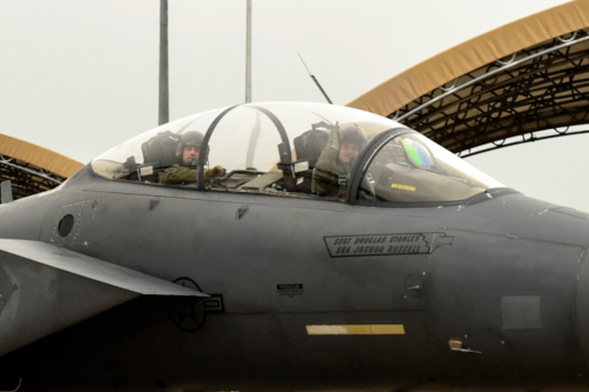 Lt. Col. Lucas Teel (right), 336th Fighter Squadron commander, waves as he and Maj. Brian Privette, 336th FS weapons system officer, taxi on the flightline, April 29, 2016, at Seymour Johnson Air Force Base, North Carolina. Approximately 14 jets left for exercise Combat Hammer, a two-week exercise at Hill Air Force Base, Utah, for combat and weapons testing. (U.S. Air Force photo by Airman Shawna L. Keyes/Released) 