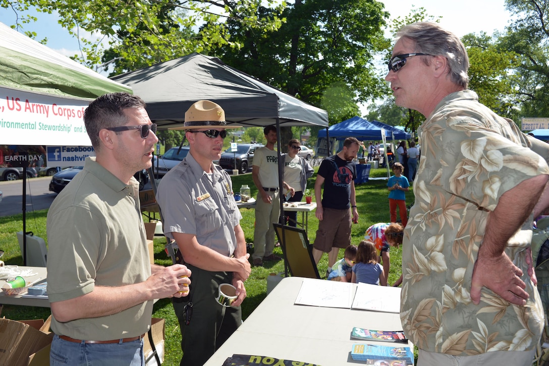 Craig Carrington, chief Plan Formulation Section and Park Ranger, Brent Sewell from Old Hickory Lake, talks to a visitor about water safety and the recreation opportunities at nearby lakes during an Earth Day Festival on April 23, 2016 in Nashville, Tenn.  
