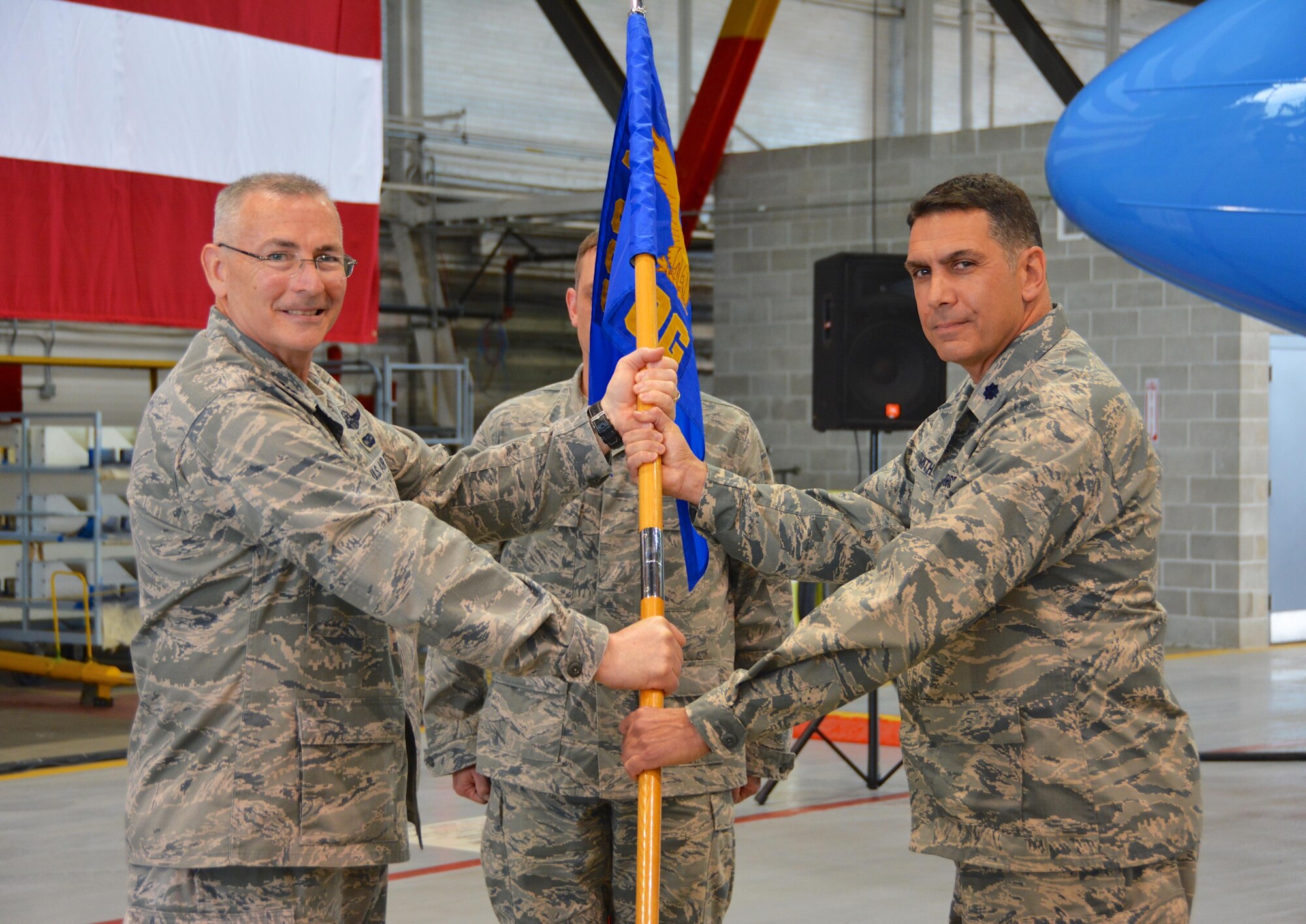 Lt. Col. Ray Smith Jr. took command of the 932nd Operations Group during a change of command ceremony April 30, 2016, at Scott Air Force Base, Ill. Prior to taking command of the 932nd OG, Smith served as director of operations for the 89th Airlift Squadron at Wright Patterson Air Force Base, Ohio. 932nd Airlift Wing Commander Col. Jonathan Philebaum, left, presented the unit's guidon to Smith in keeping with Air Force ceremonial tradition. (U.S. Air Force photo by Tech. Sgt. Jodi Ames) 