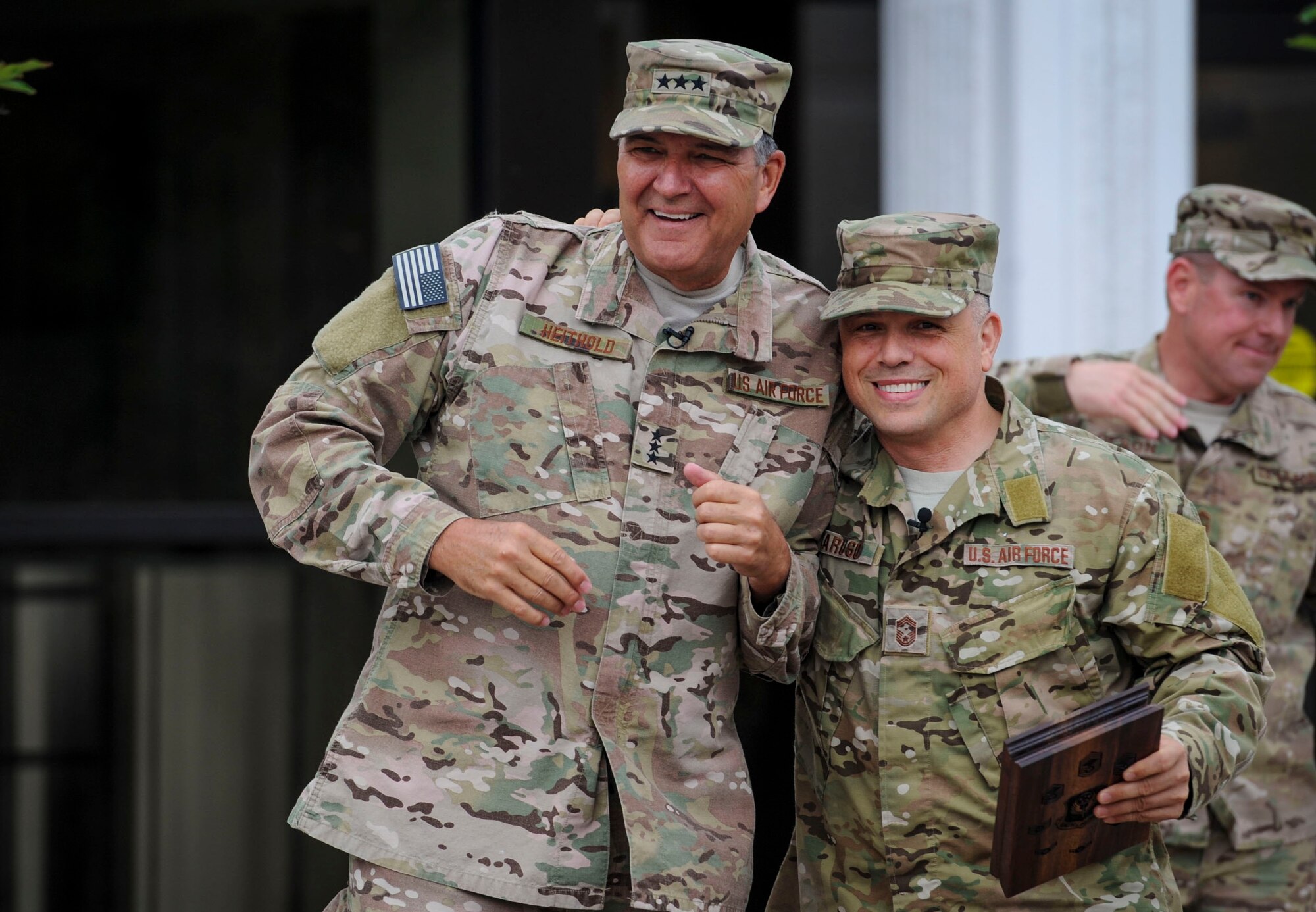 Lt. Gen. Brad Heithold, AFSOC commander, is escorted by Chief Master Sgt. Matt Caruso, Air Force Special Operations Command command chief, out to a crowd of Airmen prior to presenting him with an AFSOC Order of the Sword invitation May 2, 2016, at Hurlburt Field, Fla. An estimated 150 people joined the command chief to present Heithold his invitation. The Order of the Sword, which is the highest award the enlisted corps can bestow upon an officer, draws its heritage from military tradition where non-commissioned officers honor leaders who have made significant contributions to the enlisted corps. (U.S. Air Force photo/Senior Airman Meagan Schutter)