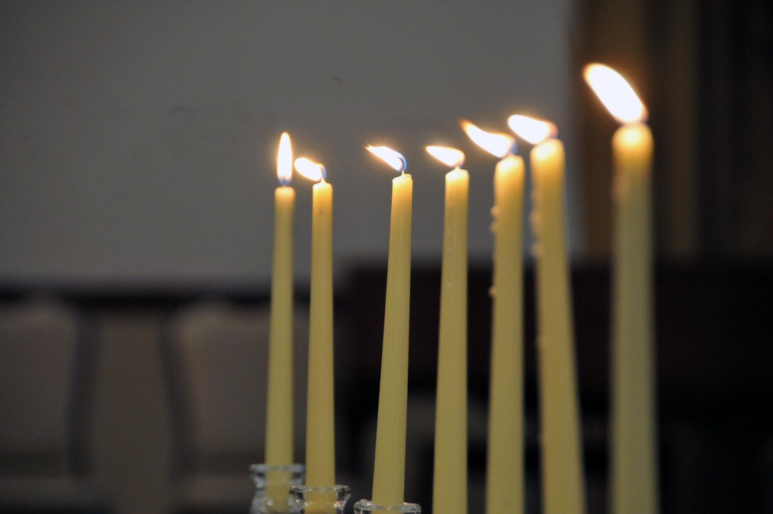 Candles are lit to honor the millions of Jews killed during the Holocaust. The candle lighting ended the Holocaust Remembrance ceremony May 2 at Tommy B's Community Center at Joint Base McGuire-Dix-Lakehurst, New Jersey.