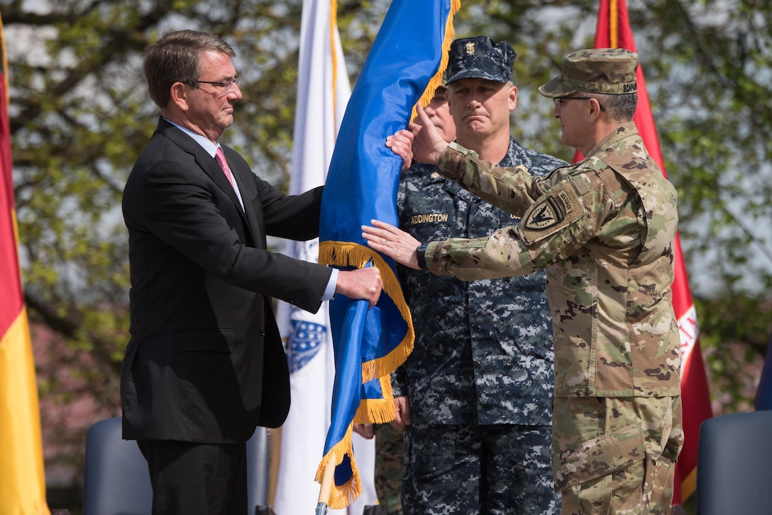 Defense Secretary Ash Carter presents the U.S. European Command flag to Eucom’s new commander, Army Gen. Curtis M. Scaparrotti, during a change of command ceremony in Stuttgart, Germany, May 3, 2016. DoD photo by D. Myles Cullen