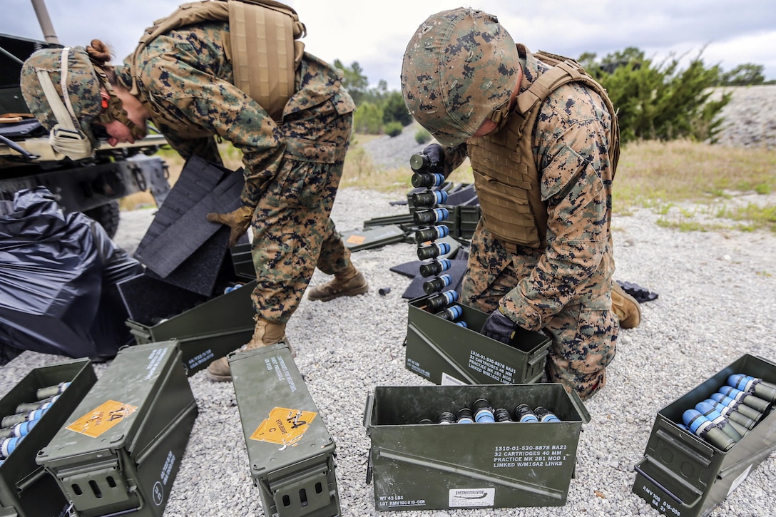 Marines prepare MK-19 automatic grenade launcher ammunition for a training event at Camp Lejeune, N.C., April 29, 2016. The training honed the Marines' accuracy, communication and suppressive fire skills. Marine Corps photo by Lance Cpl. Aaron K. Fiala