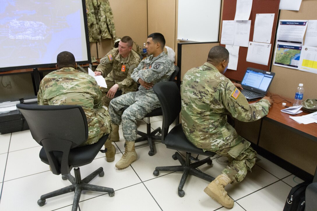 Soldiers, from a variety of installations assigned to the Logistics Task Force, go over operations plans prior to receiving deployment orders to react to a nuclear attack scenario during the annual Vibrant Response exercise at Camp Atterbury, Indiana, May 1, 2016. This event has more than 800 Soldiers participating during the first phase and an expected 1200 for the second half as well as Air Force and Marine personnel.