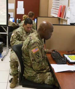 Soldiers assigned to Task Force Ops/LOCON stand-by and await orders to deploy to a nuclear attack scenario as part of the annual Vibrant Response training exercise at Camp Atterbury, Indiana, May 1, 2016. The event replicates a dynamic environment before, during and after the bomb to include effects of the blast and populace reaction. The response cells receive missions and input tasks into the simulation and monitor reports of their effects.