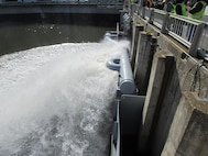 Circular cool water spray at upstream end of Lower Granite Dam adult fish ladder. U.S. Army Corps of Engineers photo.