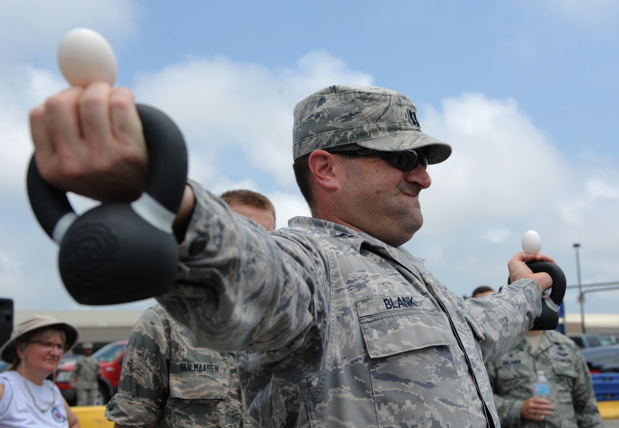 Capt. Gregory Blank, 333rd Training Squadron instructor, competes in a dragon egg hold competition during a burger burn April 29, 2016, Keesler Air Force Base, Miss. The burger burn was the final event of Wingman Week in support of Comprehensive Airman Fitness. (U.S. Air Force photo by Kemberly Groue)