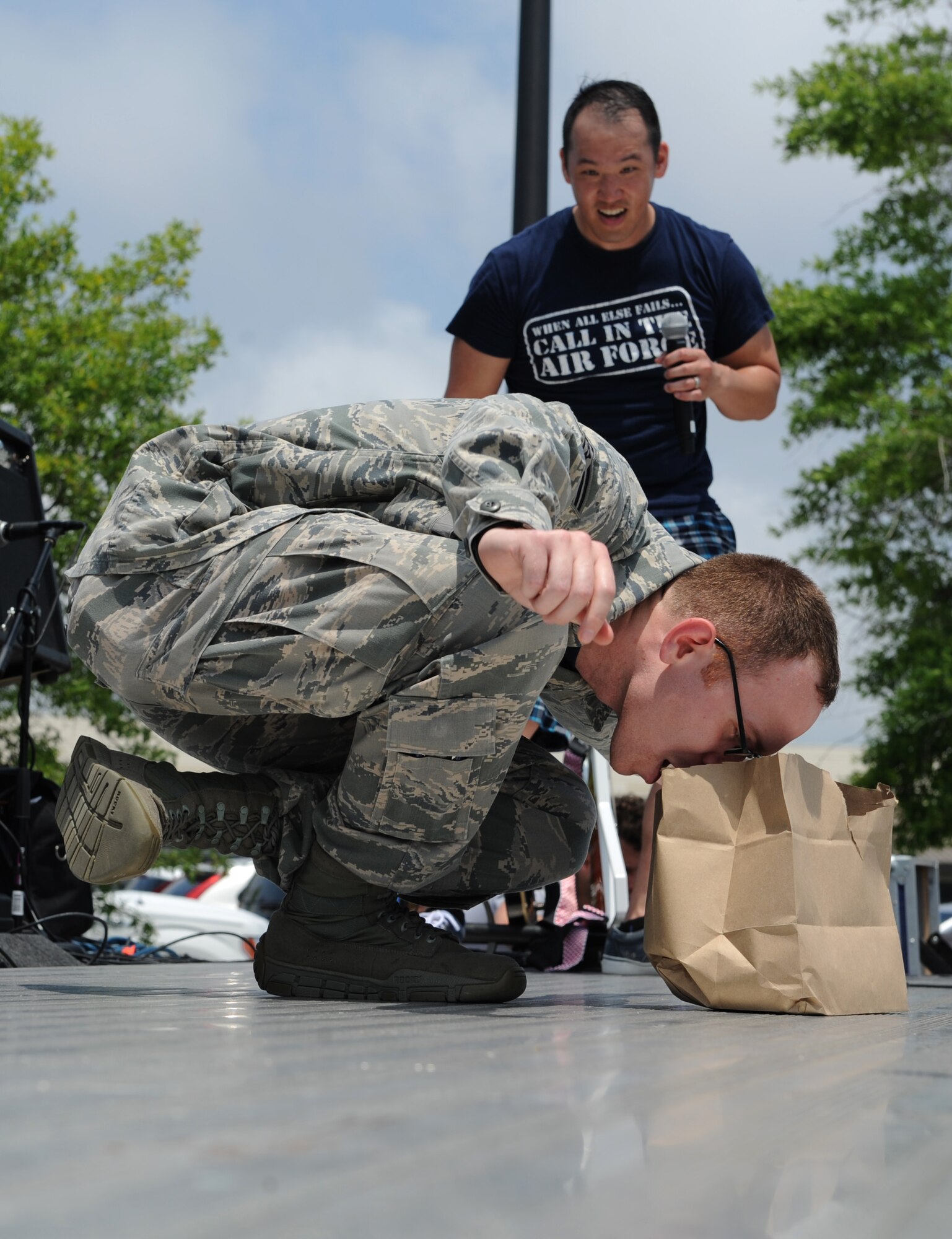 Staff Sgt. Christopher Pineda, 81st Training Support Squadron interactive media developer, competes in the dragon balance competition during a burger burn April 29, 2016, Keesler Air Force Base, Miss. The burger burn was the final event of Wingman Week in support of Comprehensive Airman Fitness. (U.S. Air Force photo by Kemberly Groue)