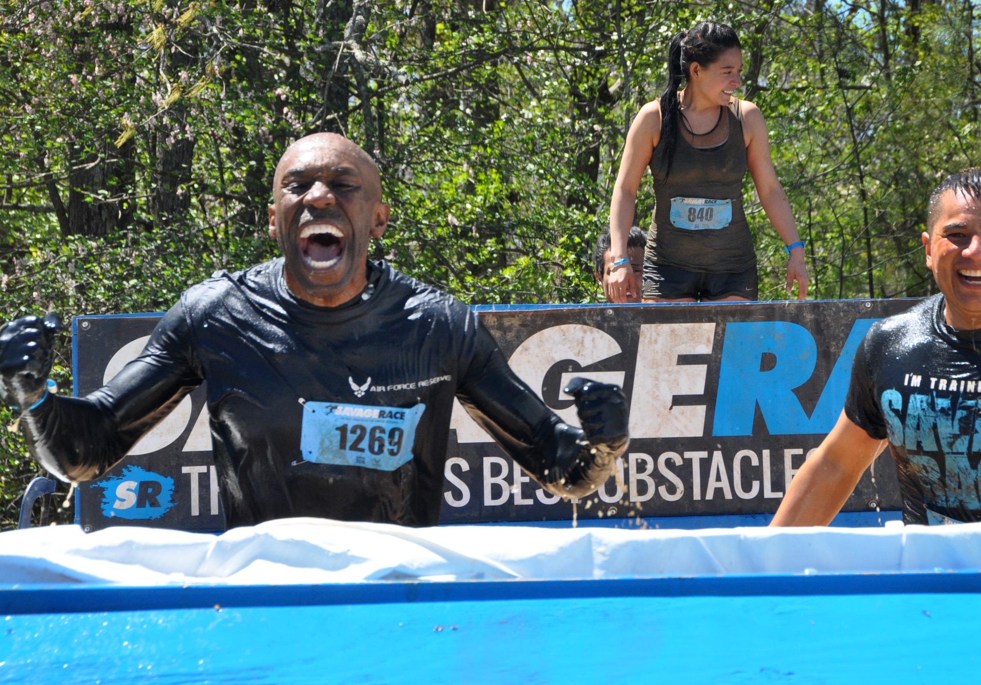 Senior Master Sgt. roars triumphantly while freezing through the ice pool at the Savage Race on April 9, 2016 in Dallas, Georgia. The Savage Race is an obstacle course and running trail that was created to push people to their physical limits and encourage teamwork. (U.S. Air Force photo by Senior Airman Lauren Douglas)