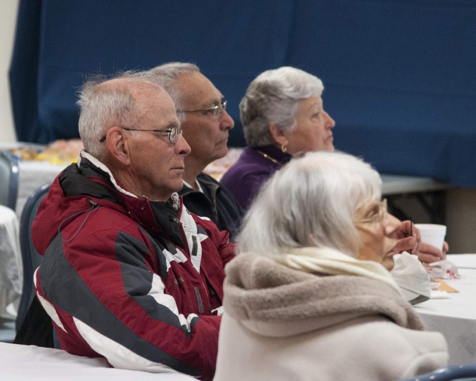 Military retirees listen to a benefits briefing during Retiree Appreciation Day on F.E. Warren Air Force Base, Wyo., April 30, 2016. Briefings touched on topics such as changes to pharmacy practices and to the Survivors Benefits Plan. (U.S. Air Force photo by Senior Airman Jason Wiese)