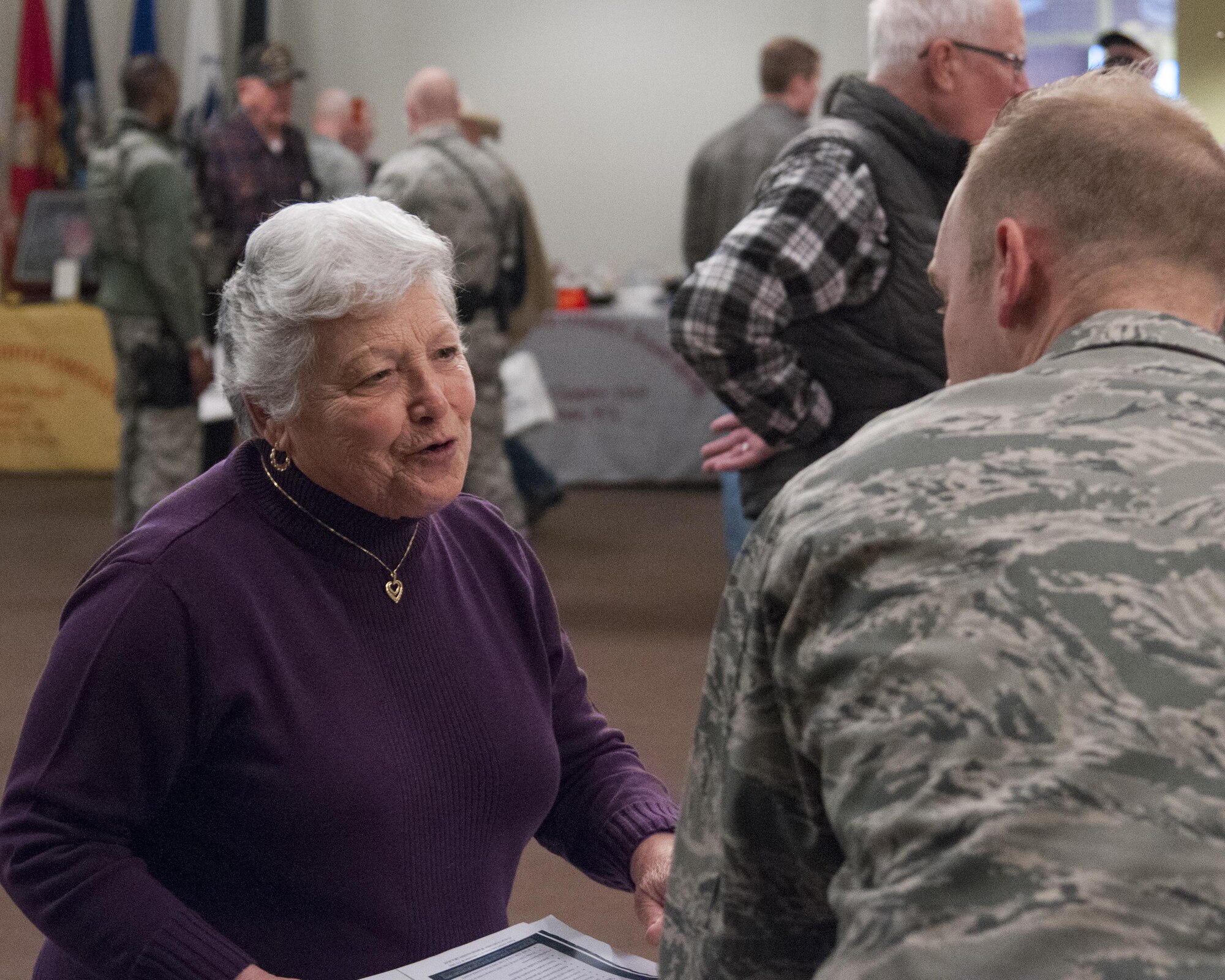 Idalina Barajas, wife of retired Master Sgt. Joe Barajas, talks with Chaplain (Capt.) Samuel McClellan, 90th Missile Wing chaplain, during Retiree Appreciation Day on F.E. Warren Air Force Base, Wyo., April 30, 2016. Barajas had questions about chapel services on base. (U.S. Air Force photo by Senior Airman Jason Wiese)