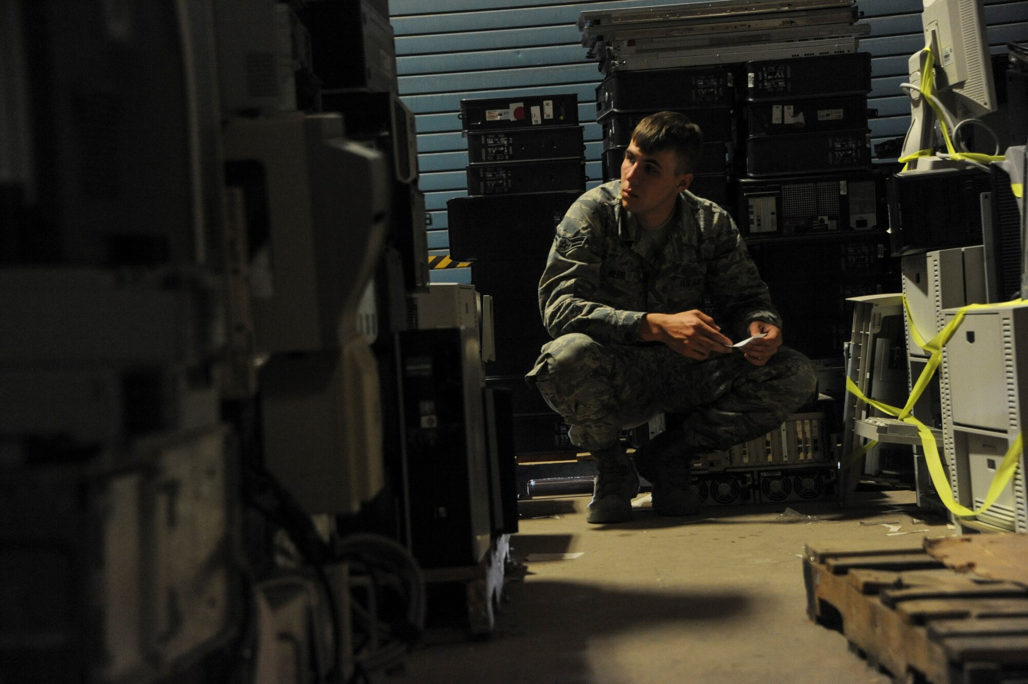 U.S. Air Force Airman 1st Class Anthony Webb, 612th Air Communications Squadron command and control systems technician, searches for equipment at Davis-Monthan Air Force Base, Ariz., April 28, 2016. Webb maintains servers and other communications equipment. (U.S. Air Force photo by Airman Nathan H. Barbour/Released)