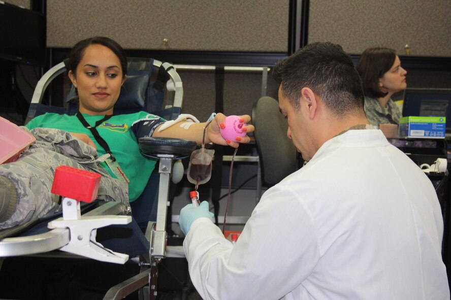 First time blood donor, Staff Sgt. Pogisa Faumuina, 225th Air Defense Group, Western Air Defense Sector, is pleased that the donation process is smooth and painless.  Faumuina’s unit held a blood drive April 30 as part of the Washington Air National Guard regularly scheduled drill weekend.  All blood donated through the Armed Services Blood Bank Center Pacific Northwest will arrive within a week in order to support service members deployed overseas. (U.S. Air National Guard photo by Capt. Kimberly Burke)
