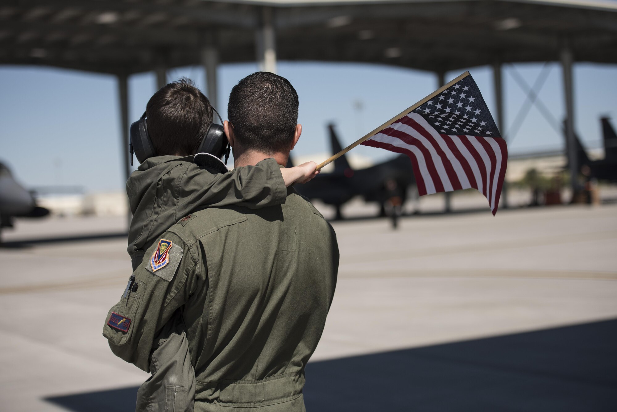 An airman and his son share a moment together, April 17, 2016, at Mountain Home Air Force Base, Idaho. Airmen with the 366th Fighter Wing constantly deploy to support missions overseas. (U.S. Air Force photo by Airman Alaysia Berry/Released)