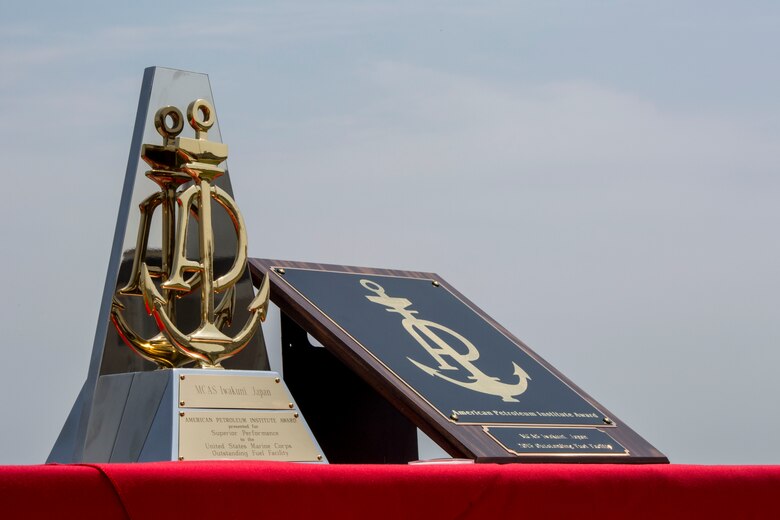 Flight line fuel operations with Headquarters and Headquarters Squadron receive the American Petroleum Institute Award on Marine Corps Air Station Iwakuni, Japan, May 2, 2016. The award –presented by Col. Robert V. Boucher, commanding officer of MCAS Iwakuni, on behalf of the Naval Systems Supply Command- recognizes the most outstanding fuel facility in the Marine Corps. (U.S. Marine Corps photo by Cpl. Nathan Wicks/Released)