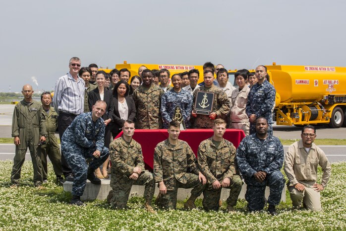 Flight line fuel operations with Headquarters and Headquarters Squadron receive the American Petroleum Institute Award on Marine Corps Air Station Iwakuni, Japan, May 2, 2016. The award –presented by Col. Robert V. Boucher, commanding officer of MCAS Iwakuni, on behalf of the Naval Systems Supply Command- recognizes the most outstanding fuel facility in the Marine Corps. (U.S. Marine Corps photo by Cpl. Nathan Wicks/Released)