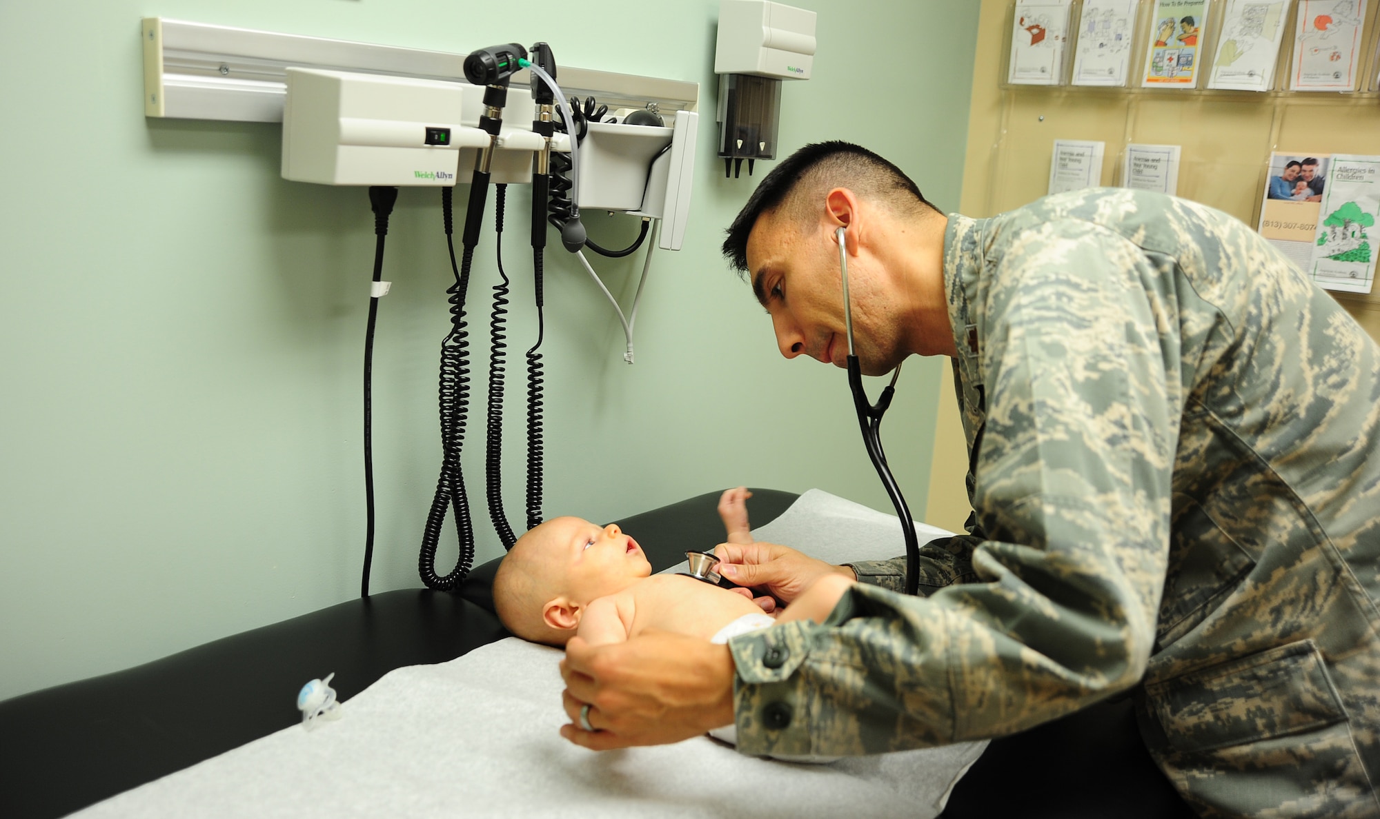 Maj. James Tschudy, a pediatrician with the 6th Medical Operations Squadron, listens to a patient’s heartbeat during a routine check-up at MacDill Air Force Base, Fla., April 21, 2016. Tschudy endured many of to the challenges military children face his life experiences allow him to have a certain reliability to military children, but even more importantly to their parents. (U.S. Air Force photo by Senior Airman Jenay Randolph)

