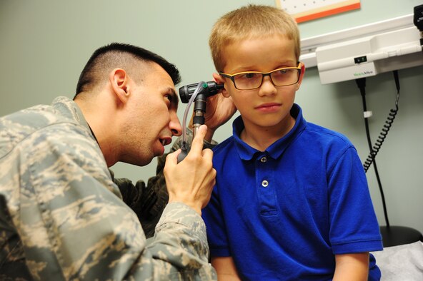 Maj. James Tschudy, a pediatrician with the 6th Medical Operations Squadron, examines a patient’s ear during a routine check-up at MacDill Air Force Base, Fla., April 21, 2016. Military children go through the same aches, illnesses and injuries that most children do, but often with the added stress of a recent PCS, parent’s deployments and military lifestyles. (U.S. Air Force photo by Senior Airman Jenay Randolph)

