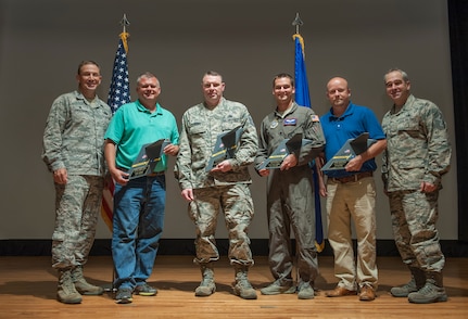 Airmen and civilians from the 437th Airlift Wing pose for a group photo with Col. John Lamontagne, 437th AW commander, and Chief Master Sgt. Kristopher Berg, 437th AW command chief, during a quarterly awards ceremony April 27, 2016, at Joint Base Charleston, S.C. The winners for the quarter are: Senior Airman Grant Smart, Tech. Sgt. William Brady, Master Sgt. William Henke, Captain Peter Theisen, Bryan Deal and John Speaks. (U.S. Air Force photo/Staff Sgt. Jared Trimarchi) 