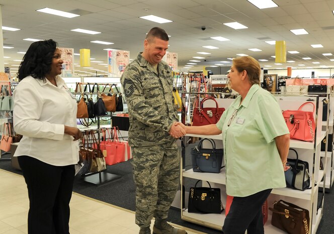 Chief Master Sgt. Sean Applegate, the Army Air Force Exchange Services senior enlisted advisor, meets with Exchange associates during a tour of the Joint Base Charleston Exchange, April 20, 2016. AAFES has Exchange facilities all over the world. Touring these facilities allows Exchange leadership to meet the specific needs of each base. (U.S. Air Force Photo/Airman Megan Munoz) 