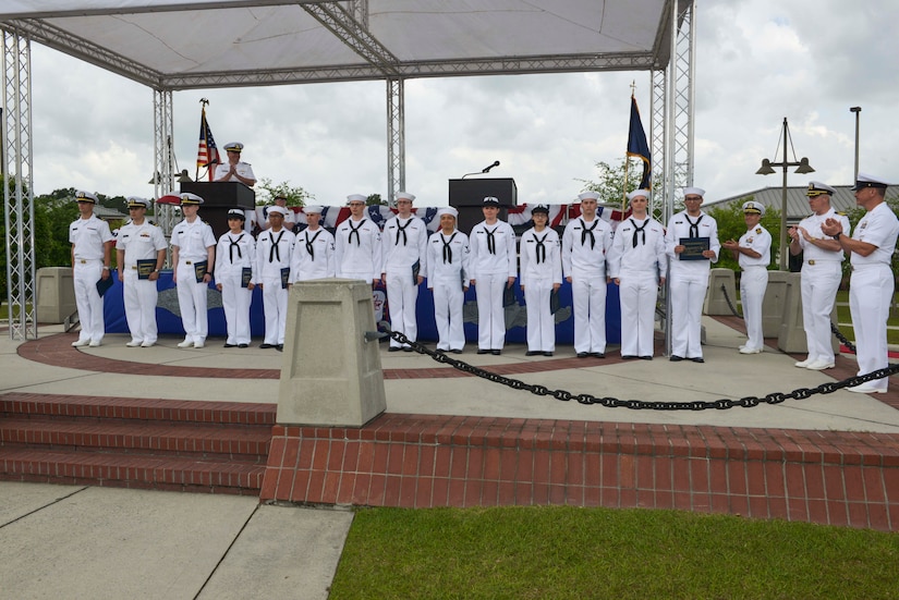 Sailors are awarded the commanding officer’s personal excellence award during the graduation ceremony of Nuclear Power School class 1601 at Naval Nuclear Power Training Command (NNPTC) on April 22, 2016. Based at Joint Base Charleston-Naval Weapons Station, NNPTC trains Sailors in the fundamentals of design, operation, and maintenance of shipboard nuclear propulsion plants. (U.S. Navy Photo by Mass Communication Specialist 2nd Class Corey Dill)