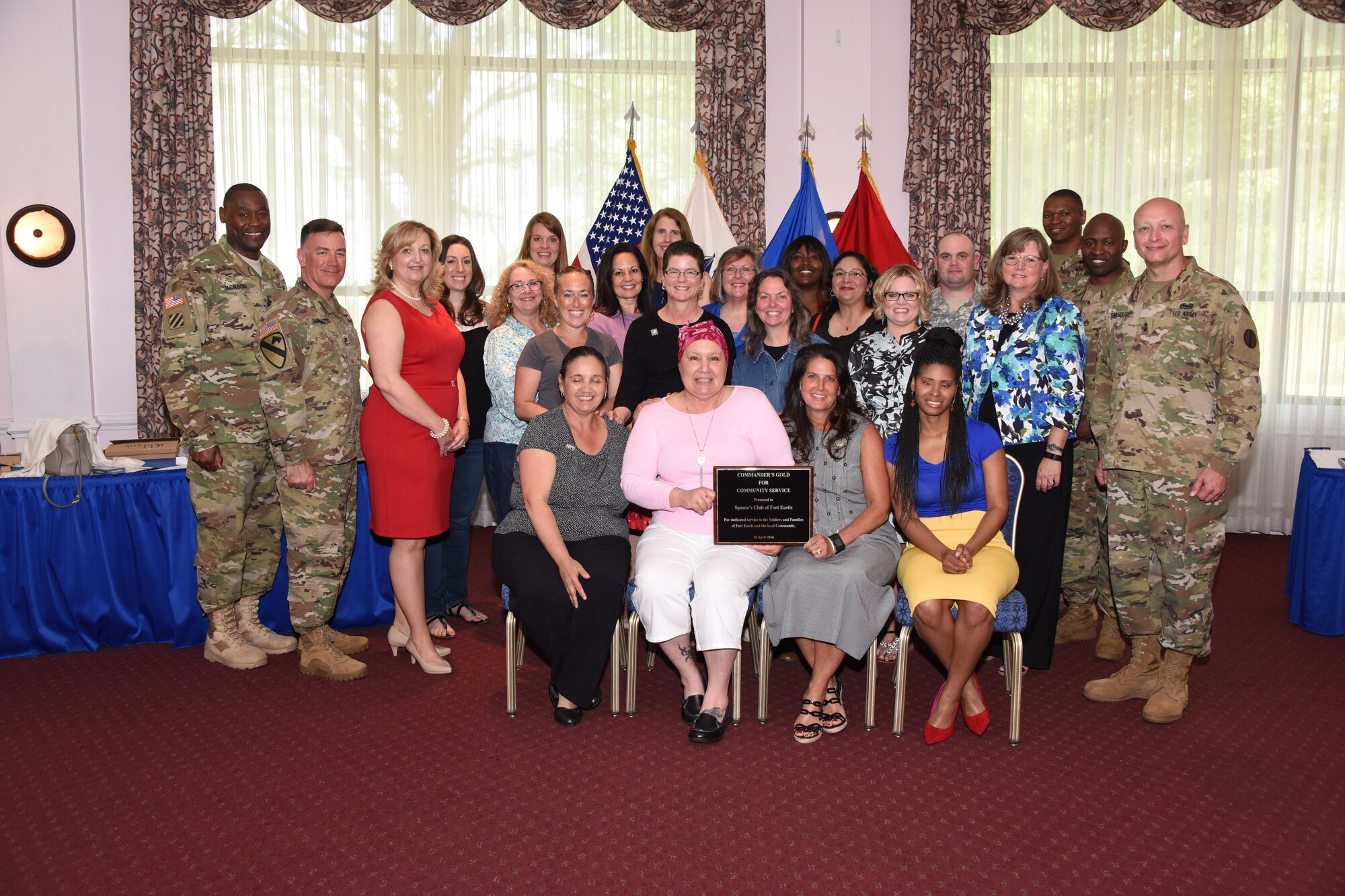 Fort Eustis and U.S. Army Training and Doctrine Command leadership pose with the Fort Eustis Spouses Club, winners of the Commander’s Gold Volunteer of the Year award, for a photo at an awards ceremony at Fort Eustis, Va., April 25, 2016. The Commander’s Gold  Award recognizes organizations that improve quality of life on Fort Eustis for Soldiers and their families.   (U.S. Army photo by Rodney E. Speed)