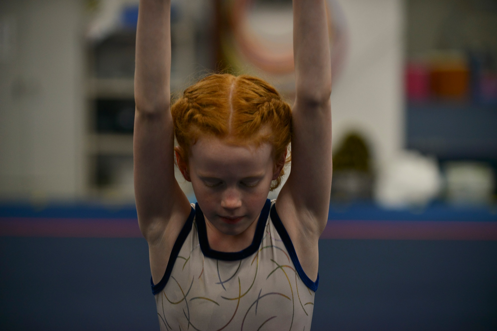 Ally Aspen, a Fort Eustis military child, prepares to do a somersault during an aerial acrobats practice in Hampton, Va., April 12, 2016. Ally aims to one day join Cirque du Soleil, and practices the sport 8-16 hours a week in hopes of getting closer to her dream. (U.S. Air Force photo by Staff Sgt. Natasha Stannard)