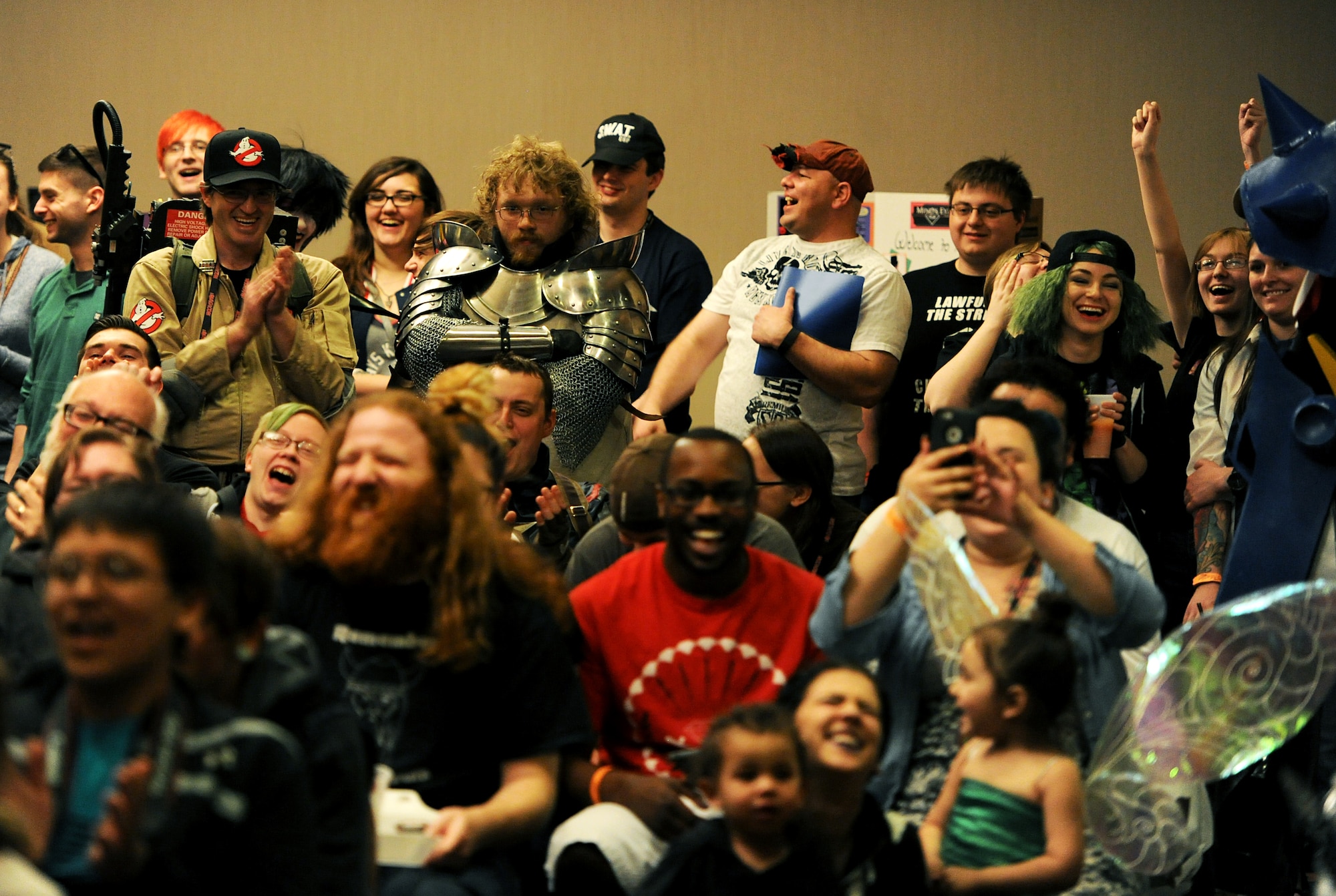 Several members from the local community dressed up in pop culture costumes at iMagicon at Minot, N.D., Apr. 23, 2016. iMagicon is a comic book convention that showcases local filmmakers, local businesses and promotes anything pop culture, several Airmen from Minot Air Force Base volunteered during the three day event. (U.S. Air Force photo by Staff Sgt. Chad Trujillo)