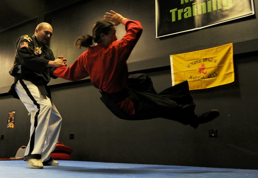 Glenn Weeks and Anthony, Golden Dragon Martial Arts, demonstrate different defensive techniques at iMagicon at Minot, N.D. Apr. 23, 2016. iMagicon is a comic book convention that showcases local filmmakers, local businesses and promotes anything pop culture, several Airmen from Minot Air Force Base volunteered during the 3 day event. (U.S. Air Force photo by Staff Sgt. Chad Trujillo)
