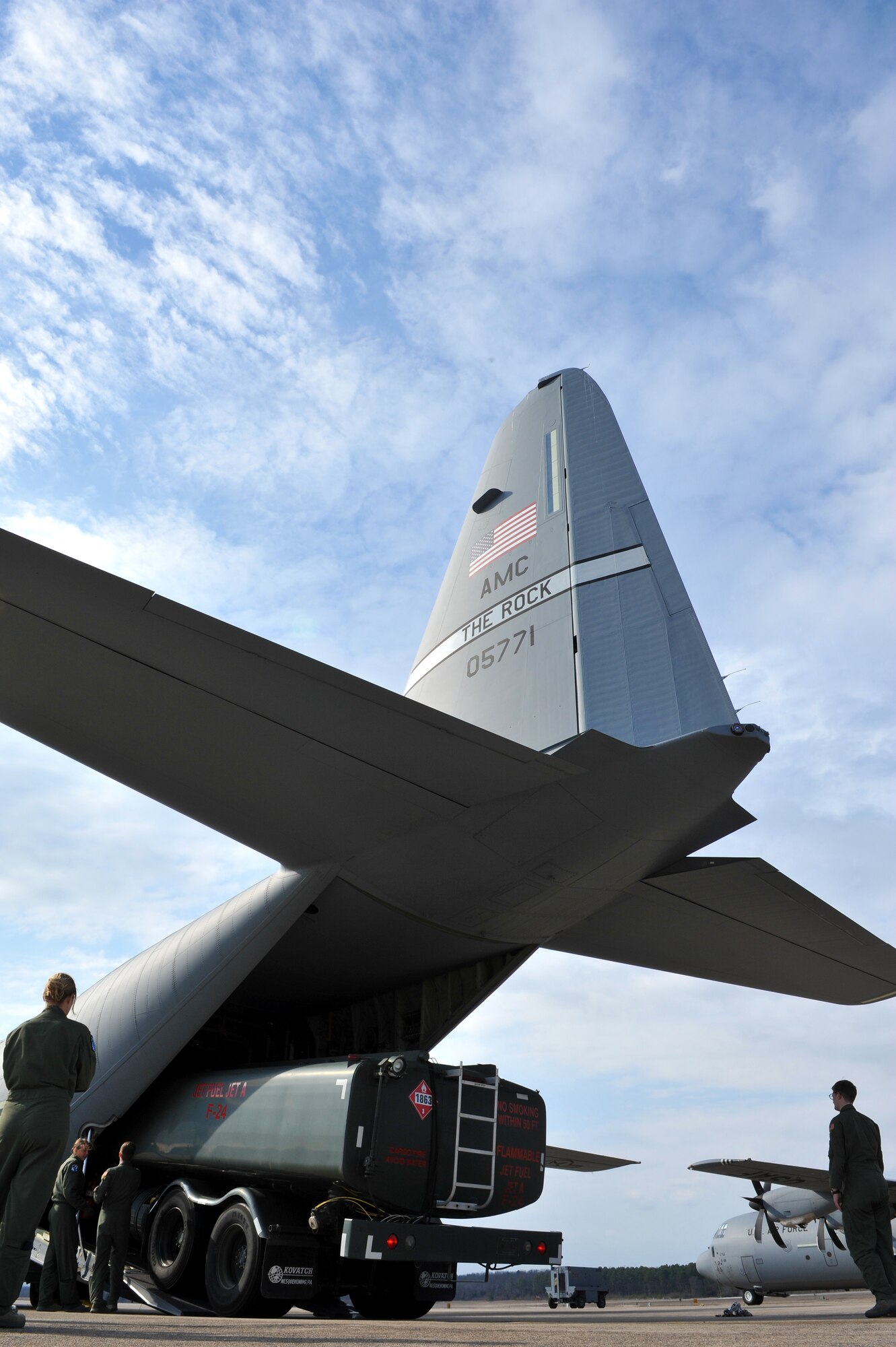 Loadmasters from the 61st Airlift Squadron load a fuels truck into the back of a C-130J, Feb. 19, 2016 at Little Rock Air Force Base, Ark. The training exercise ensured that loadmaster and pilots are capable of loading a variety of assets onto a Hercules. (U.S. Air Force photo/SSgt Jeremy McGuffin)