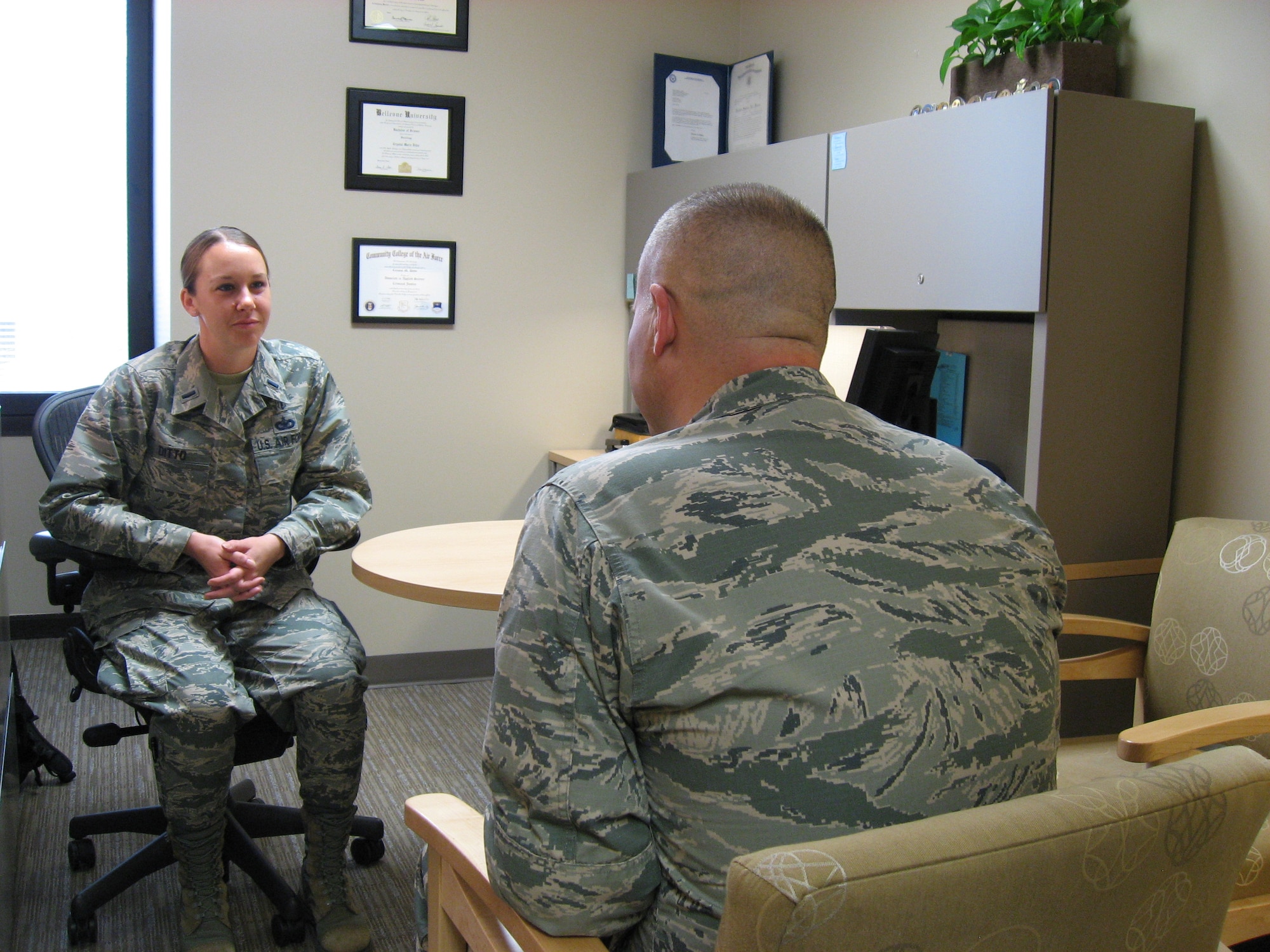 Maj. Thomas Smith, Mental Health Flight clinical training director and 1st Lt. Crystal Ditto, clinical social worker demonstrate a counseling session in the Mental Health Flight, located in the Wright-Patterson Medical Center. 
(U.S. Air Force photo / Kimberly Gaither)