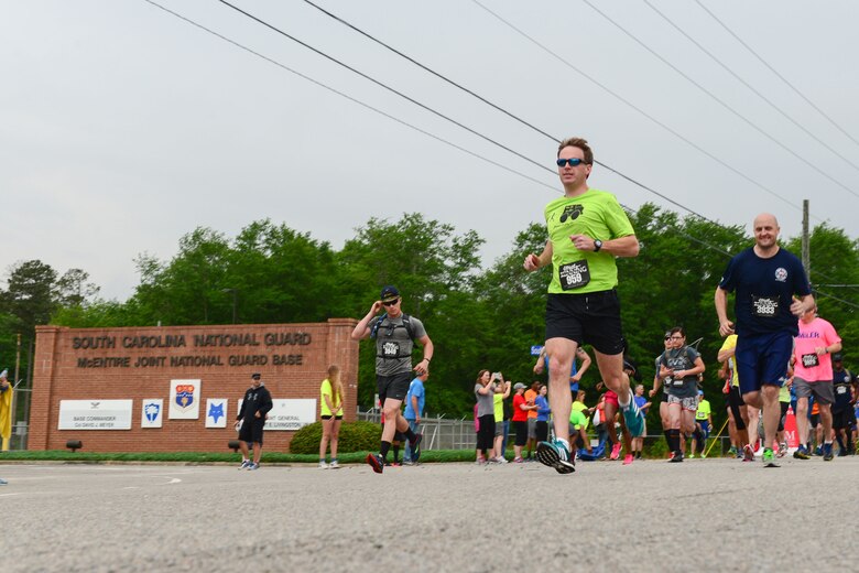Runners participate in the inaugural YMCA-Sumter Base-2-Base Race, May 1, 2016 along Garners Ferry Road, in Eastover, S.C. The 21-mile race began at the front gate of McEntire Joint National Guard Base with the finish line at Shaw Park, near Shaw Air Force Base.  (U.S. Air National Guard photo by Airman 1st Class Megan Floyd)