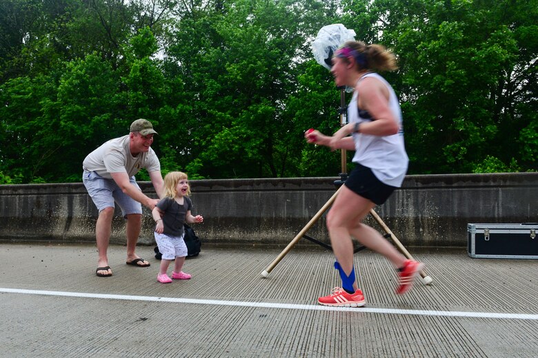 Family members cheer on runners in the inaugural YMCA-Sumter Base-2-Base Race, May 1, 2016 along Garners Ferry Road, in Eastover, S.C. The 21-mile race began at the front gate of McEntire Joint National Guard Base with the finish line at Shaw Park, near Shaw Air Force Base.  (U.S. Air National Guard photo by Airman 1st Class Megan Floyd)