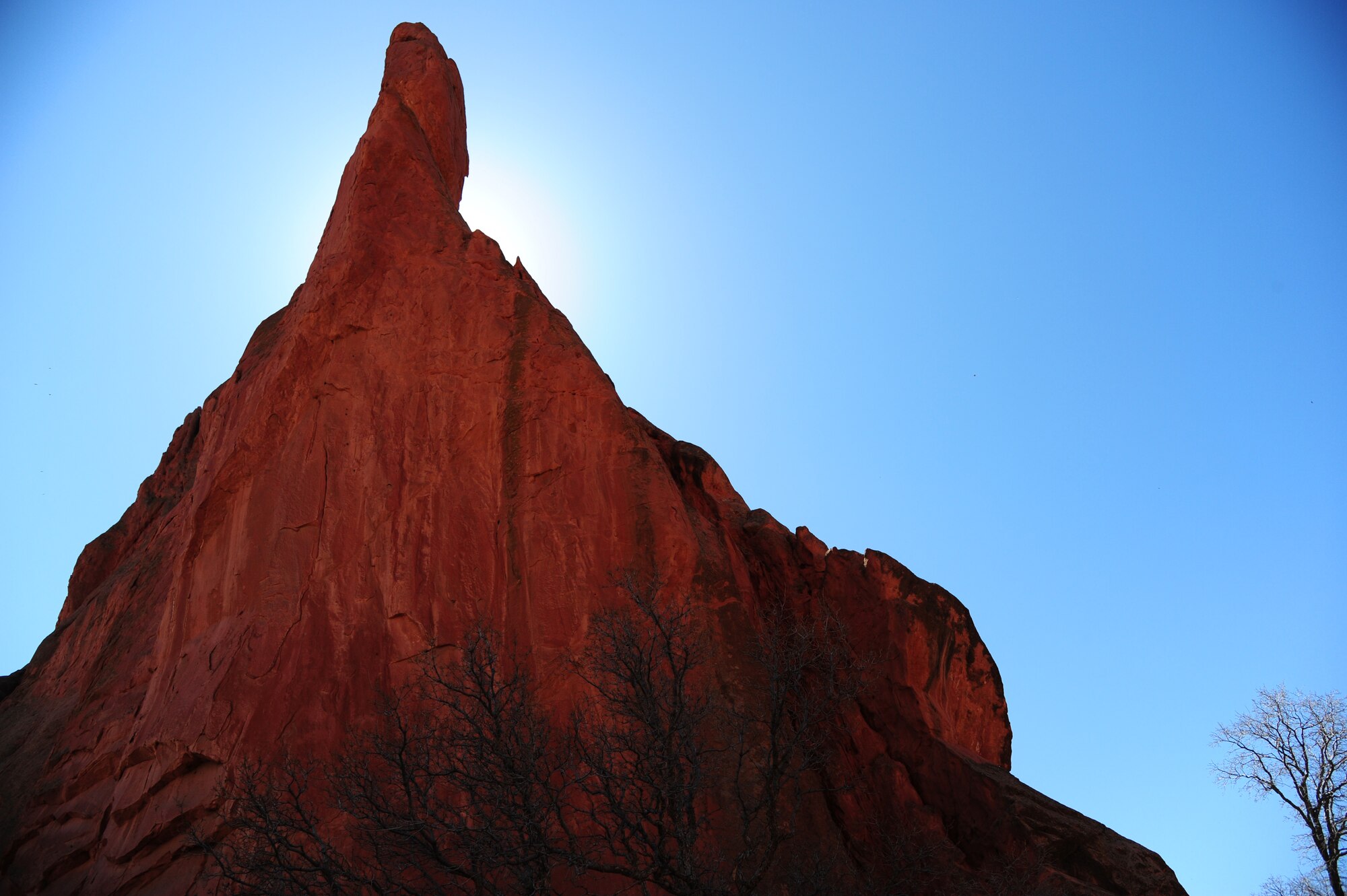 COLORADO SPRINGS, COLO.  – A spire of orange sandstone rises 200 feet into the sky in Colorado’s Garden of the Gods, April 7, 2016. This mammoth rock formation is just one of the many at the park. The garden is also home to such famous rock formations as the Tower of Babel, Gateway Rock, the Three Graces, Kissing Camels, the Sleeping Giant and the Balanced Rock. (U.S. Air Force photo/Staff Sgt. Amber Grimm)