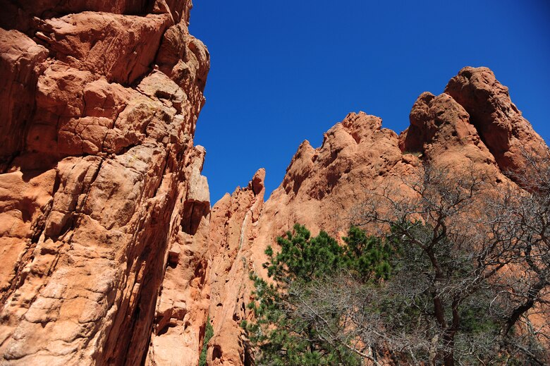 COLORADO SPRINGS, COLO.  – Towering slabs of orange sandstones rise 300 feet above the Garden of the Gods, April 7, 2016. Traveling the park’s paths will get you up-close views of famous rock formations like the Tower of Babel, Gateway Rock, the Three Graces, Kissing Camels, the Sleeping Giant and the Balanced Rock.  (U.S. Air Force photo/Staff Sgt. Amber Grimm))