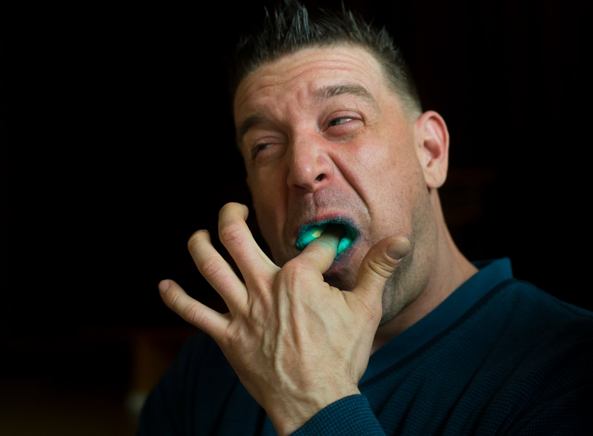 Master Sgt. Michael Peters, U.S. Air Forces in Europe long-haul systems communications manager, participates in a competition to see how many marshmallows he can fit in his mouth during a community engagement event with local nationals in Landstuhl, Germany, April 23, 2016. Several events held to include a three-legged race, pin-the-tail on the rabbit, origami lessons and many more. (U.S. Air Force photo/Senior Airman Jonathan Stefanko)